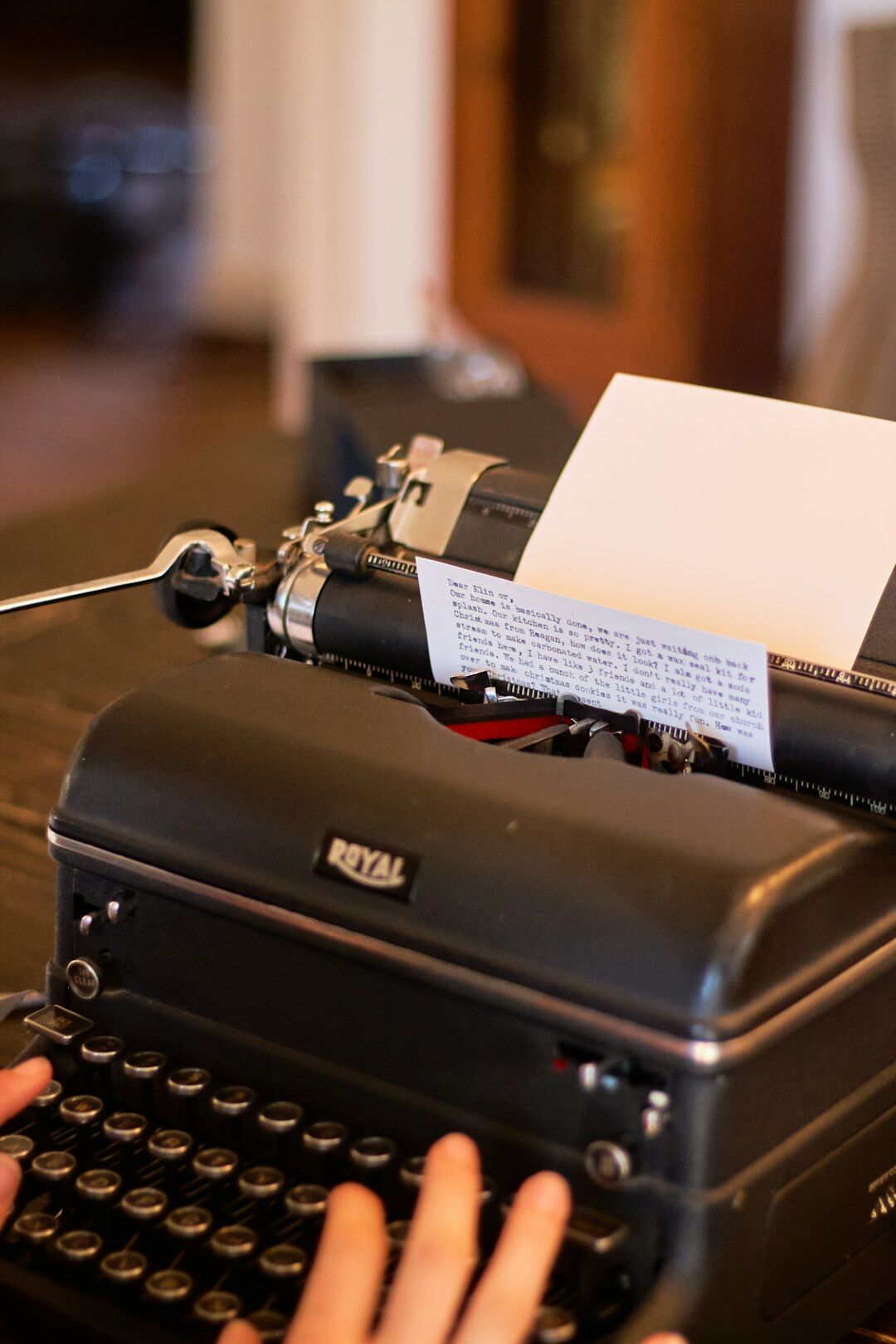 writer typing on old typewriter