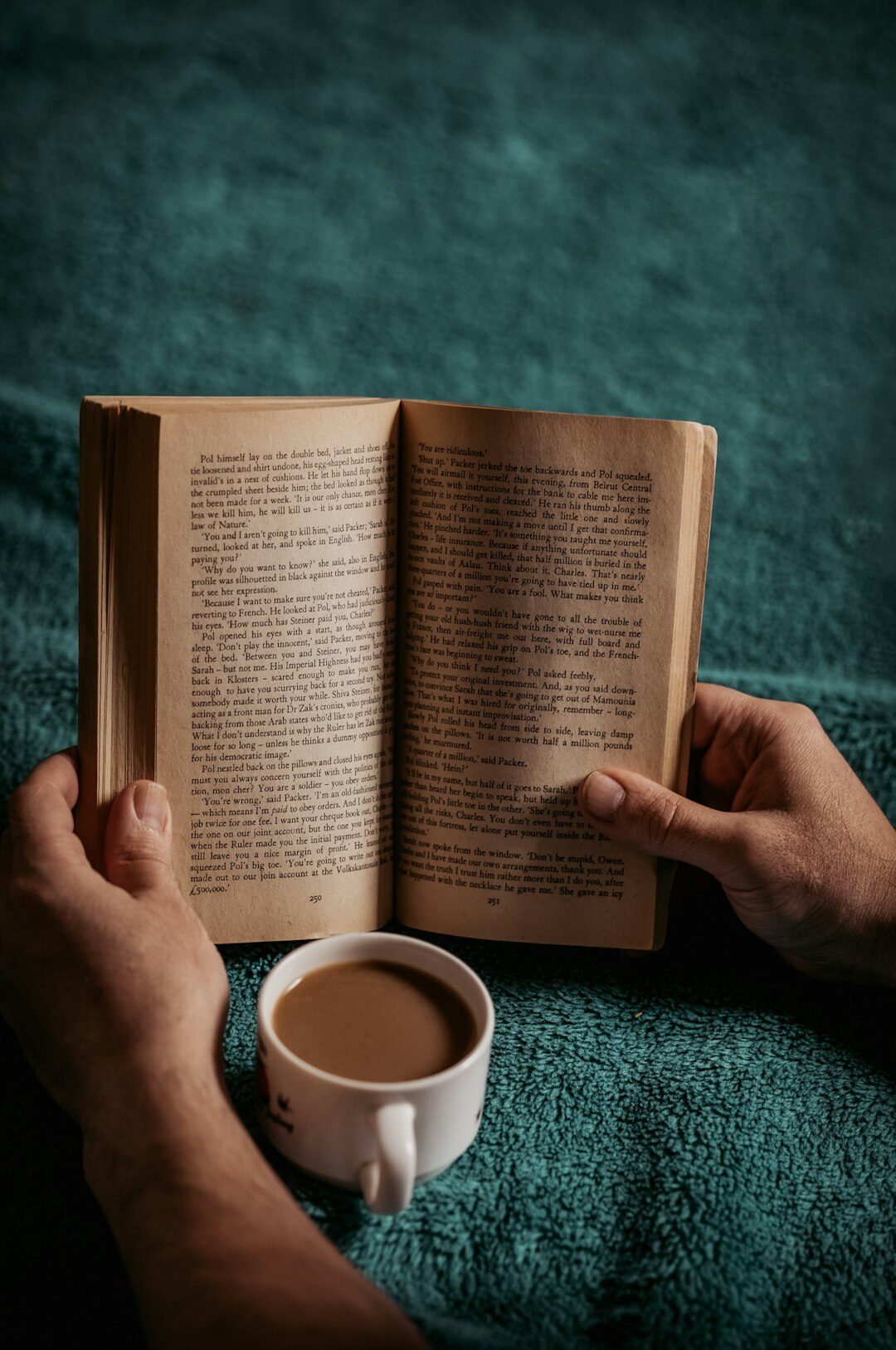 person turning book page