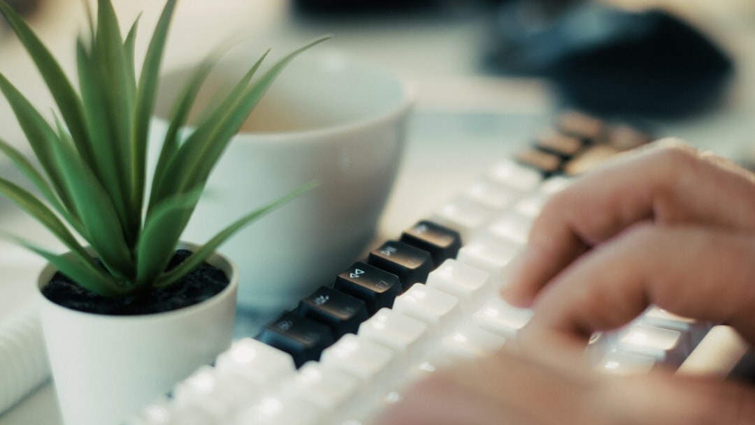 mystery writer typing at desk